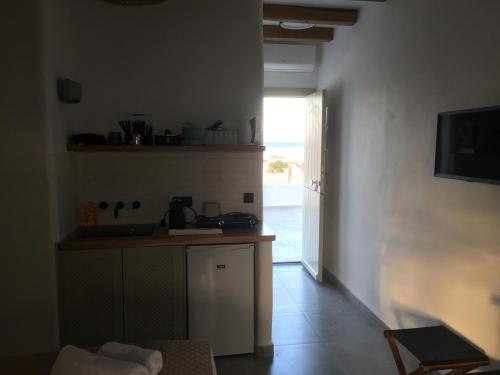 a kitchen with a sink and a counter top at AGERI HOME in Koufonisia