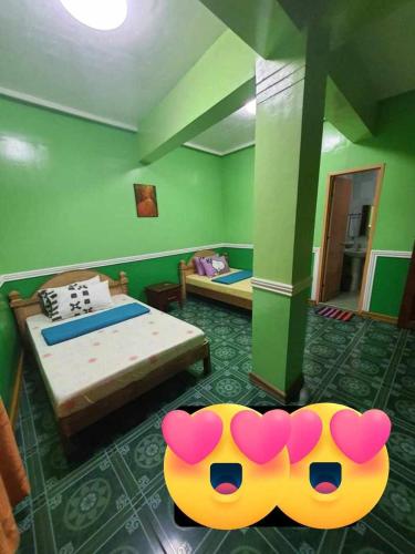 a room with a bedroom with a bed at ASHBURN'S TRANSIENT BAGUIO - 3rd to 5th floor BASIC SLEEP and GO Accommodation, WITH PARKING, NO ELEVATOR in Baguio