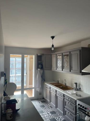 a kitchen with a sink and a counter top at Champs Bernard in Villefranche-de-Rouergue