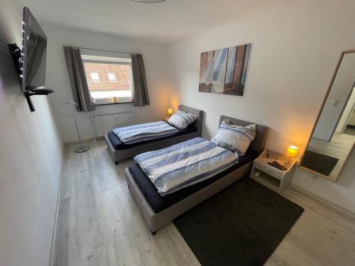 En eller flere senge i et værelse på Haus Weitblick Alva