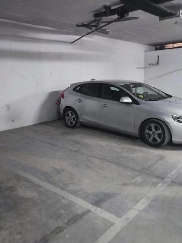 a silver car parked in a parking garage at Puerto Barrio Alto in El Puerto de Santa María
