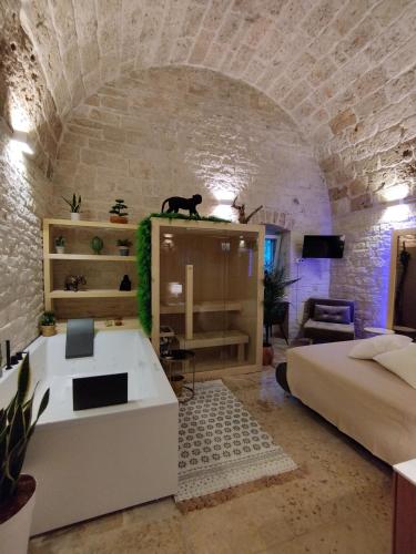 a room with a bed and a couch in a room at Alle volte Maison deluxe in Giovinazzo