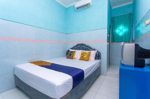 Llit o llits en una habitació de Nafata Ajibarang