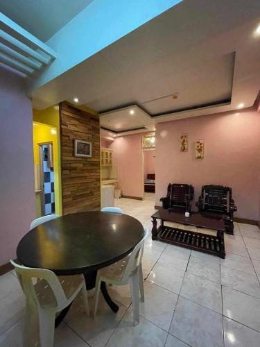 a dining room with a table and chairs at ASHBURN'S TRANSIENT BAGUIO - 3rd to 5th floor BASIC SLEEP and GO Accommodation, WITH PARKING, NO ELEVATOR in Baguio