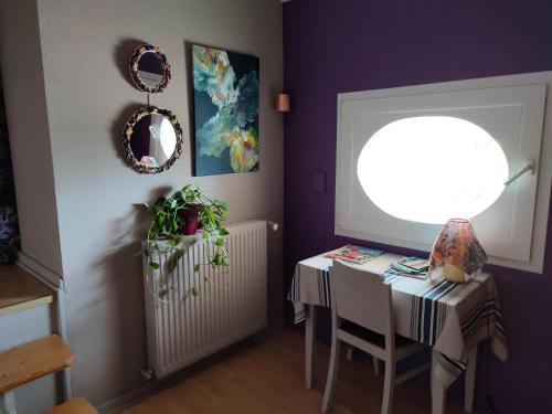 a dining room with a table and a window at Chambre d'hôtes Sauternais in Pujols-sur-Ciron