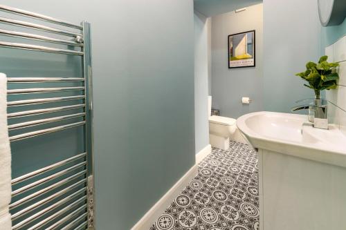 a bathroom with a sink and a toilet at Clock Tower Retreat - Sea View Apartments in Morecambe in Morecambe