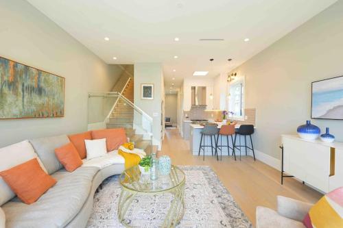 a living room with a couch and a table at Four bedrooms New Lovely Duplex House-1628 in Vancouver