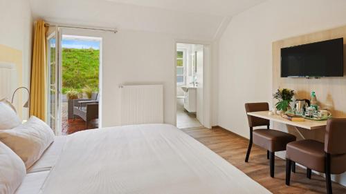 Postel nebo postele na pokoji v ubytování Hotel Deichinsel