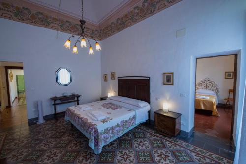 Postel nebo postele na pokoji v ubytování Palazzo De Luigi