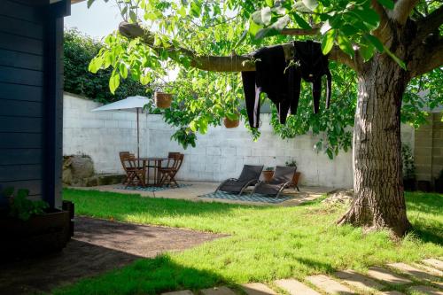 a statue of a cow hanging from a tree at Bajo el Nogal in Camargo