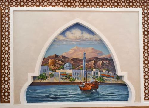 a painting of a boat in the water at Durrat Nizwa Inn in Nizwa