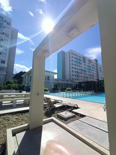 Kolam renang di atau dekat dengan R&R Cozy 2BR Marina Dumaguete