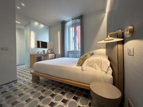 Un pat sau paturi într-o cameră la Affittacamere Dai Baracca