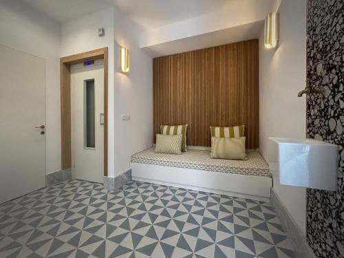 a hotel room with a bench in the hallway at Affittacamere Dai Baracca in Riomaggiore