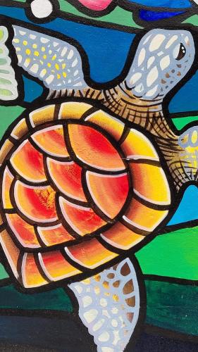 a painting of a turtle on a wall at Hotel Hawaian Paradise in Hawaii