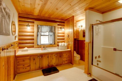 a bathroom with a tub and a sink and a toilet at Pet-Friendly Bayfield Cabin with Game Room and Hot Tub in Vallecito