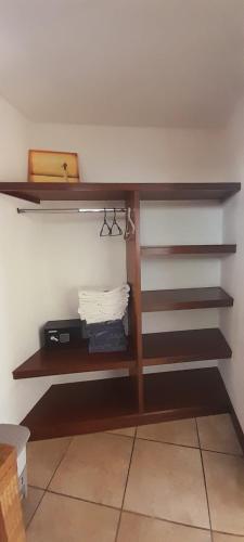 a shelf in a room with stairs on a wall at Hotel Hawaian Paradise in Hawaii