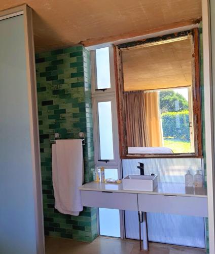 a bathroom with a sink and a window at Our Place-at-Notties Self-contained 2-Bed unit in Notties in Nottingham Road