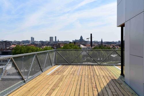 a balcony with a view of a city at Hôtel Belvue in Brussels