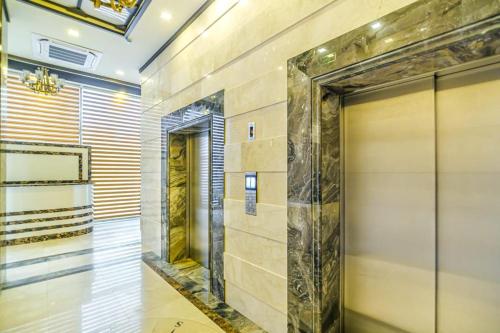 a elevator lobby with a door in a building at Special VIP Mariott Apartment in Baku