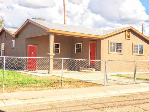 a house with a fence in front of it at White Sands Casita in Alamogordo