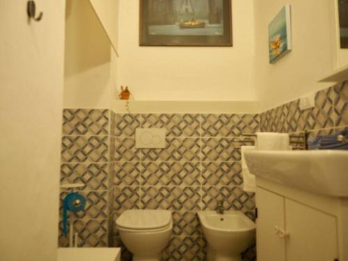 a bathroom with a toilet and a sink at Mister G home in the heart of Turin in Turin