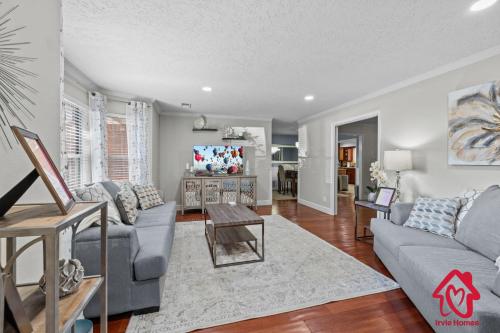 a living room with a couch and a table at San Gabriel Stunner - An Irvie Home in Albuquerque