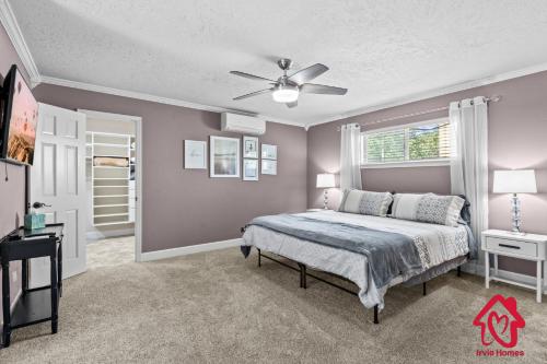 a bedroom with a bed and a ceiling fan at San Gabriel Stunner - An Irvie Home in Albuquerque