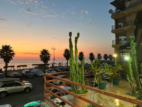 a view of a parking lot with cars parked at Blue Apartment in Gonio