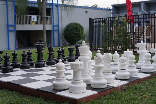 a chessboard is sitting on the grass at Celebration Suites in Orlando