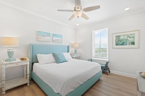 a bedroom with a bed and a ceiling fan at Pescador Landing 6A in Pensacola