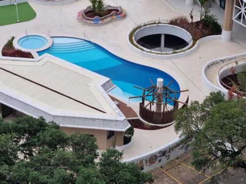 an overhead view of a swimming pool at a resort at DerSalvador Sol Victoria Marina Studios in Salvador