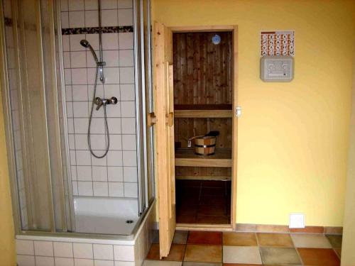 a bathroom with a shower and a walk in shower at Strandrose in Brasilien
