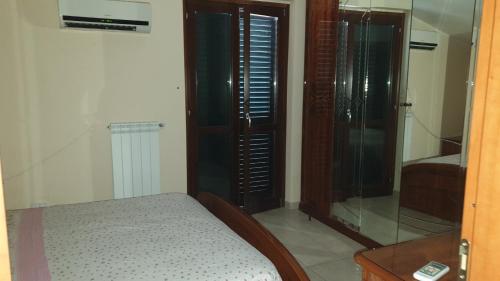 Кровать или кровати в номере Villetta in residence privato totale relax