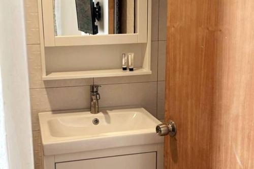 a bathroom with a sink and a mirror at Casa Carmen Culebra- Gibraltar in Culebra