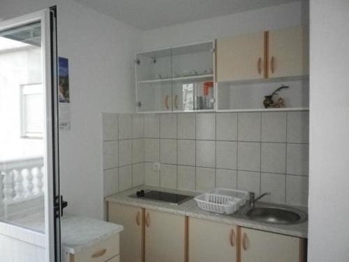 a kitchen with a sink and a counter top at Apartmentsin Pasman with Air condition, WIFI 4650-1 -2 in Pašman