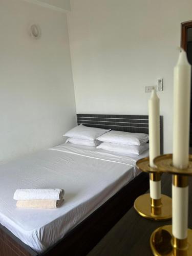 Ένα ή περισσότερα κρεβάτια σε δωμάτιο στο Aeonsky apartment Negombo beach and airport