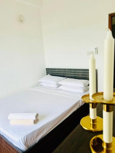 Ένα ή περισσότερα κρεβάτια σε δωμάτιο στο Aeonsky apartment Negombo beach and airport