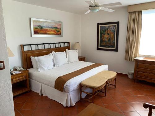 Ένα ή περισσότερα κρεβάτια σε δωμάτιο στο Hotel Boutique Casa de Campo