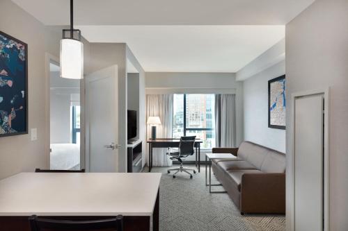 a living room with a couch and a table at Residence Inn by Marriott Boston Back Bay/Fenway in Boston