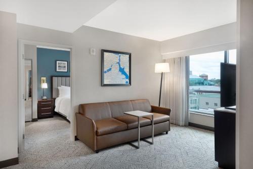 a living room with a couch and a bed at Residence Inn by Marriott Boston Back Bay/Fenway in Boston