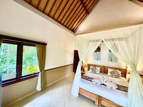 Cama o camas de una habitación en Dupa Ubud