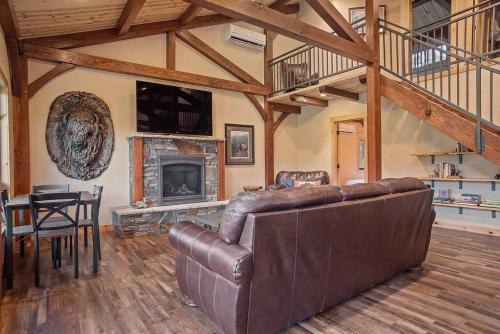 a living room with a couch and a fireplace at Hot Shot Hideaway in Custer