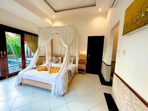 Cama o camas de una habitación en Dupa Ubud
