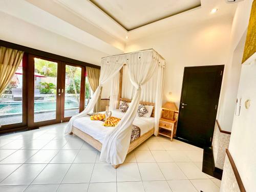 Cama o camas de una habitación en Dupa Ubud