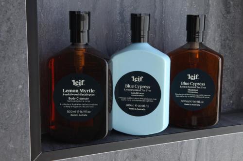 three bottles of left lemon syrup and black curses on a shelf at Avion Retreat in Pumpenbill
