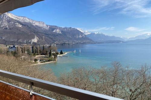 a view of a large body of water with mountains at LE SOLAVUE 150 M2 VUE EXCEPTIONNELLE SUR LE LAC in Annecy