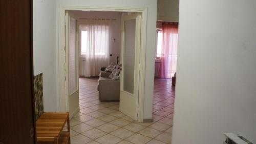 a hallway of a living room with a couch at Casetta Seaside in Ladispoli