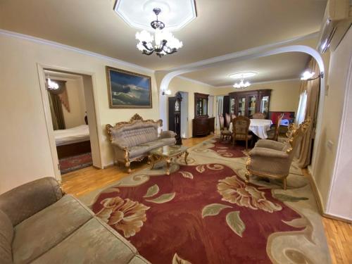 a living room with a couch and a table at VIP Hotel-Villa 3 in the center in Yerevan