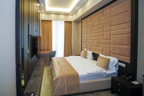 Llit o llits en una habitació de Soho Apart Hotel
